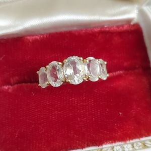 10k white topaz ring size 8. Resizeable by a jeweler. Stamped 10k. Great stones
